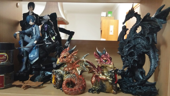 Display of gothic Anime figurines and Dragons