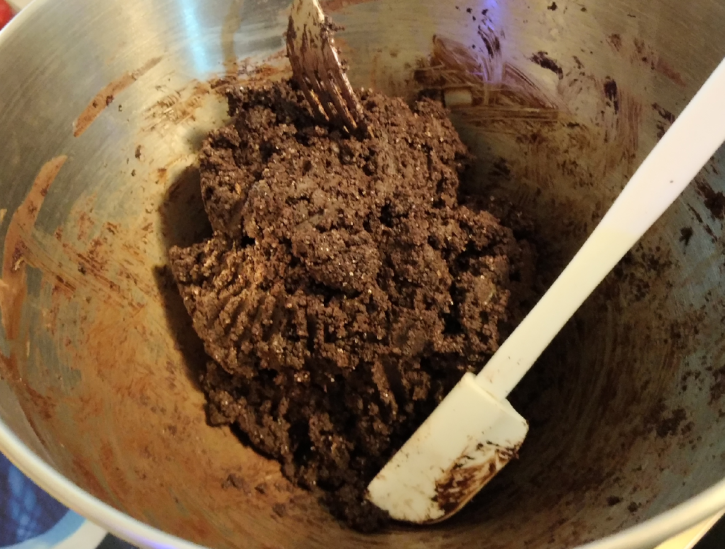 Tablea chocolate mixture being finished off by hand mixing
